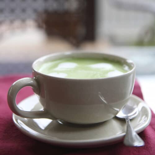 espresso matcha latte in white cup and saucer