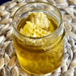 greek honey in jar with honeycomb